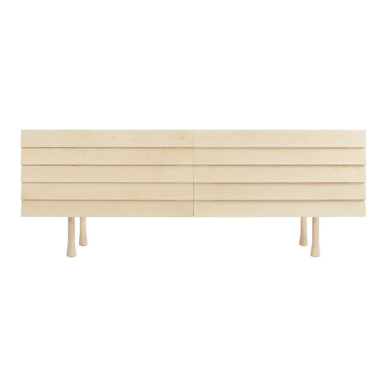 Light natural wood TV stand with slatted design and minimalistic legs, showcasing a clean and modern aesthetic.