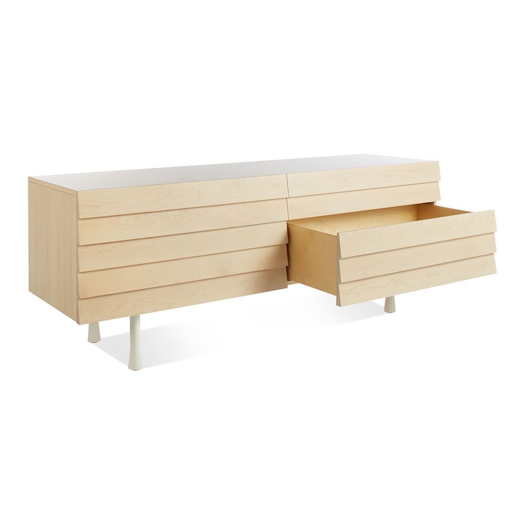 Light wood sideboard with a minimalist design, featuring smooth, horizontal drawer lines and a natural finish.