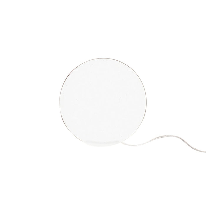 White circular lamp with a sleek design and minimalistic style, featuring a thin silver trim and a white cord.