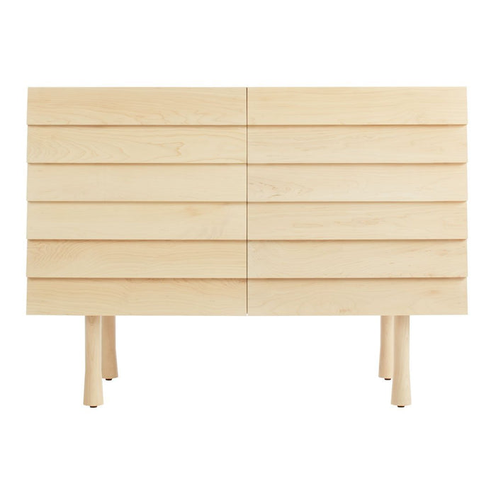 Light maple wood dresser with horizontal slatted design and natural finish. Simple, modern aesthetic.