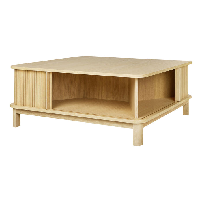 Light wood coffee table featuring a smooth surface and ribbed side panel design, perfect for modern decor.