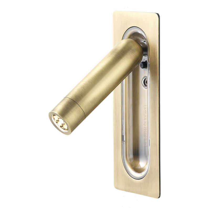 Brass wall light with a sleek cylindrical design and minimalist rectangular base for modern decor.