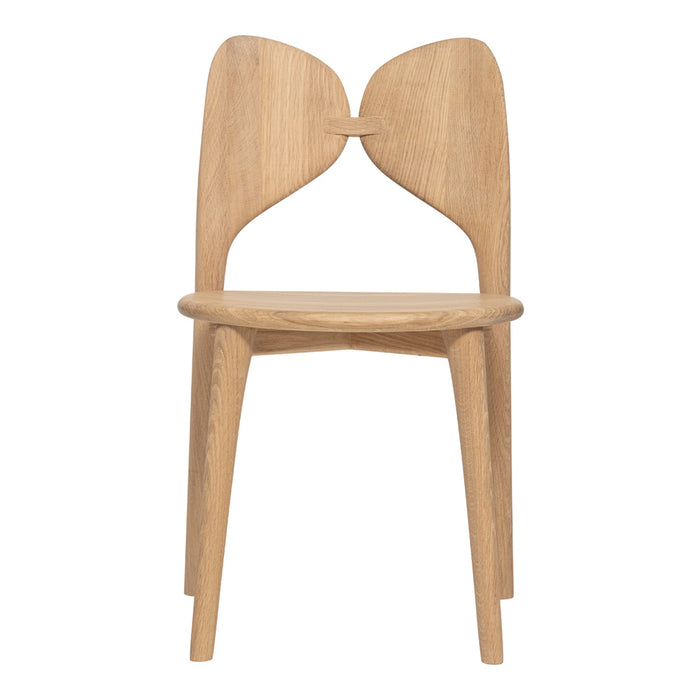 Natural light wood chair with a minimalist design, featuring smooth curves and a seamless finish. Ideal for modern decor.