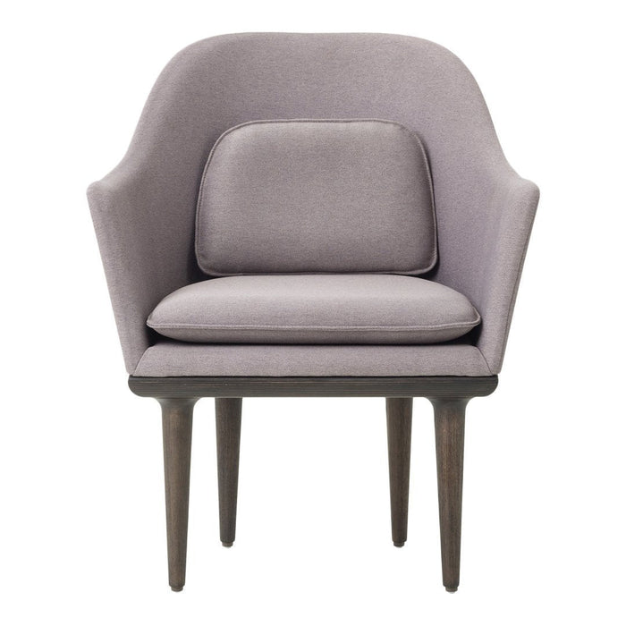 Lavender accent chair with smooth upholstery and dark wooden legs, featuring a minimalist design and soft curves.