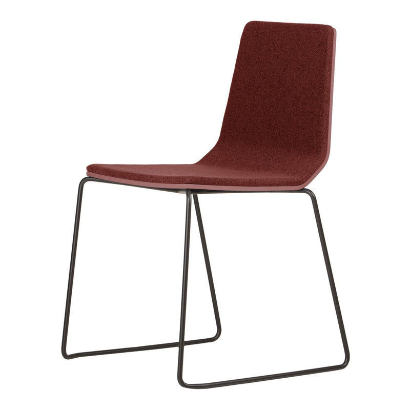Burgundy upholstered chair with a minimalist design and sleek black metal legs, perfect for modern decor.