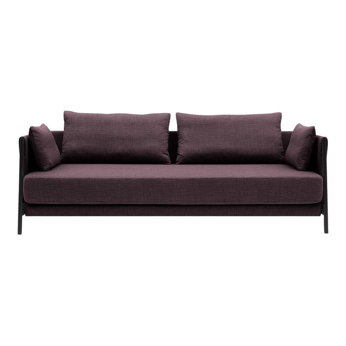 Deep purple sofa with sleek black frame and matching cushions, offering a modern, minimalist design.