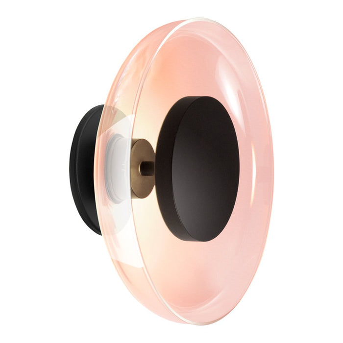 Glossy pink and clear glass lamp with a sleek black base, featuring a modern circular design.