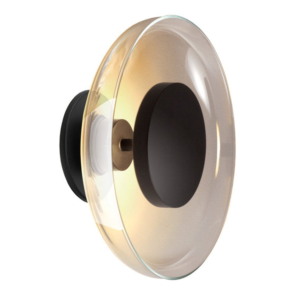 Elegant round light fixture with a subtle amber glass shade and a matte black base, creating a modern aesthetic.