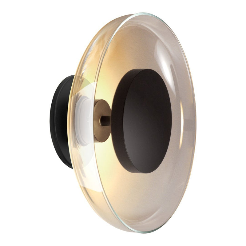 Elegant round light fixture with a subtle amber glass shade and a matte black base, creating a modern aesthetic.