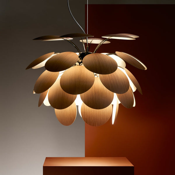 Wooden pendant lamp featuring layered rounded petals in warm brown tones against a contrasting dark background.