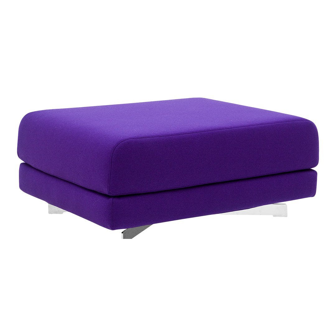 Purple upholstered ottoman with a sleek, modern design and minimalist shape. Ideal for contemporary decor.