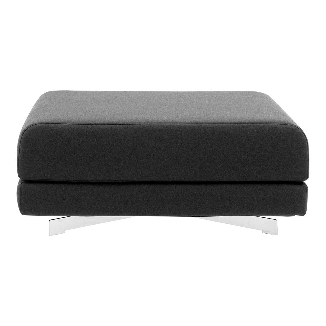 Sleek black upholstered ottoman with a smooth surface and modern chrome legs. Stylish and minimalist design.
