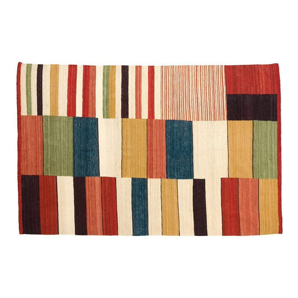 Colorful woven rug featuring stripes and rectangles in red, green, blue, yellow, and cream. Ideal for vibrant decor.