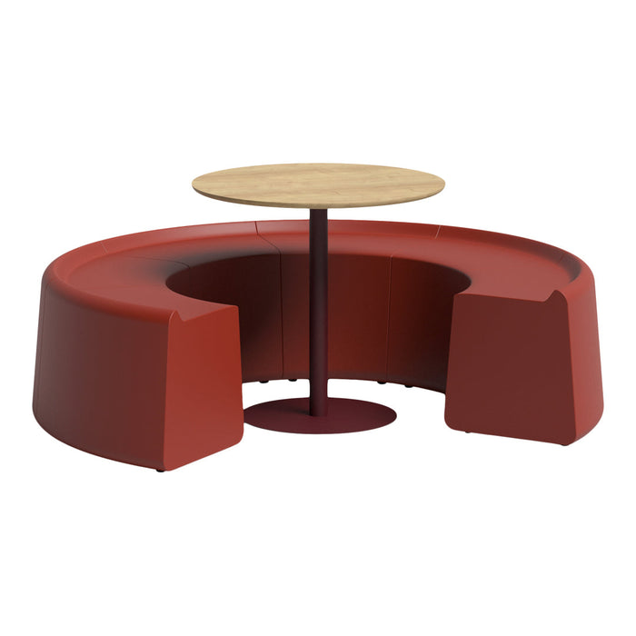 Modern circular seating in deep red with a natural wood tabletop and a maroon base. Stylish and inviting furniture piece.