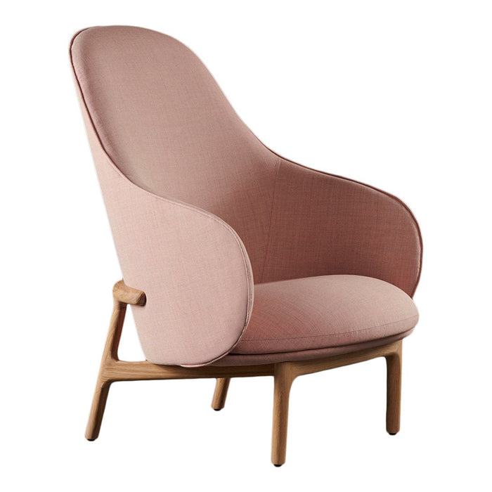 Soft pink upholstered chair with smooth curves and natural wood legs, perfect for modern decor.