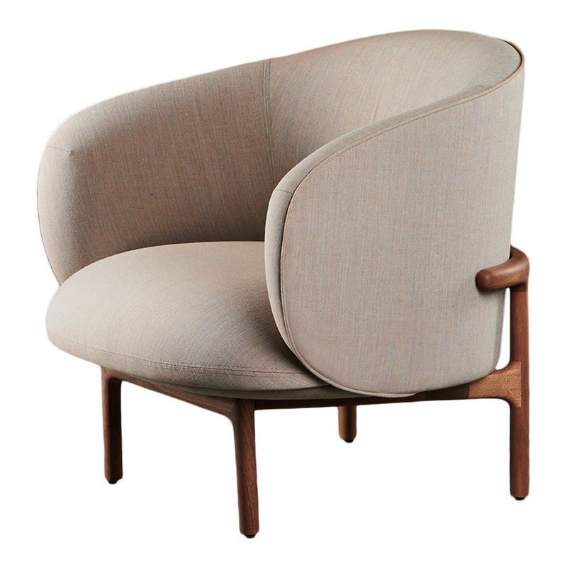 Beige curved accent chair with a smooth texture and warm wooden legs. Modern design perfect for stylish interiors.