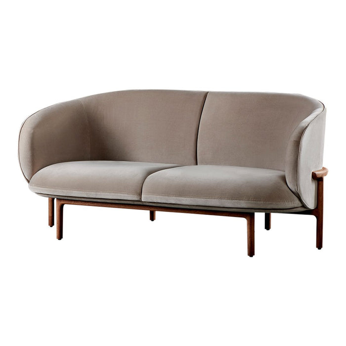 Elegant taupe sofa with smooth, curved lines and minimalist wooden legs, perfect for modern decor.