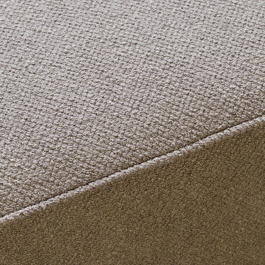 Textured beige fabric with a subtle woven pattern, adding depth and warmth to any space. Perfect for modern decor.