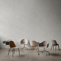 Set of modern chairs in neutral tones: brown, beige, gray, featuring varied textures and patterns on upholstery.