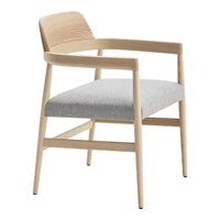 Light wood armchair with a textured natural wood back and a soft gray upholstered seat.