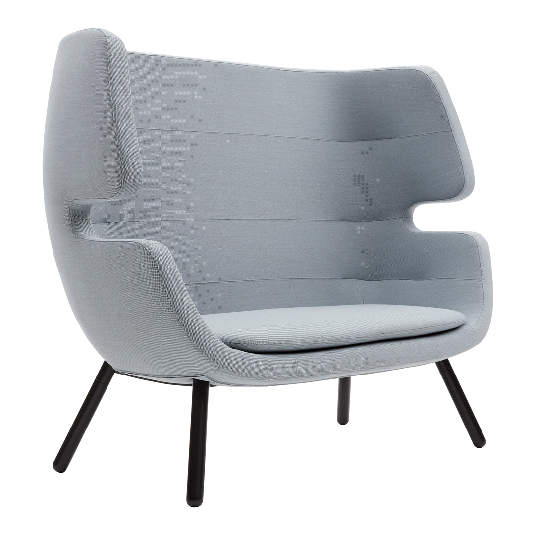 Light grey upholstered armchair with structured lines and smooth curves, featuring sleek black legs.