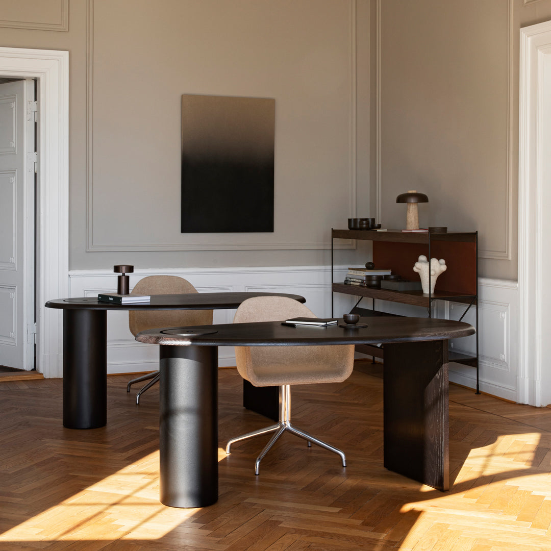Modern office with black and beige tones, natural wood patterns, and soft texture contrasts for a stylish workspace.