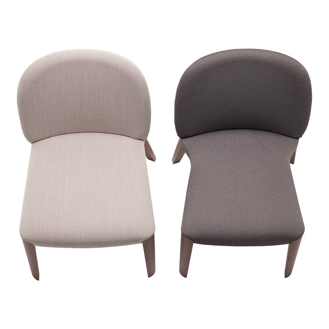 Set of two lounge chairs in light beige and dark gray with textured upholstery and rounded backs.