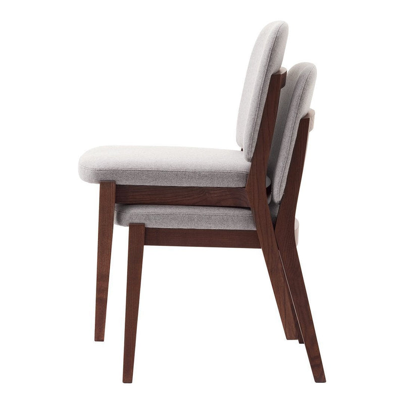 Stylish gray upholstered dining chairs with walnut wood legs, featuring a sleek, modern design.