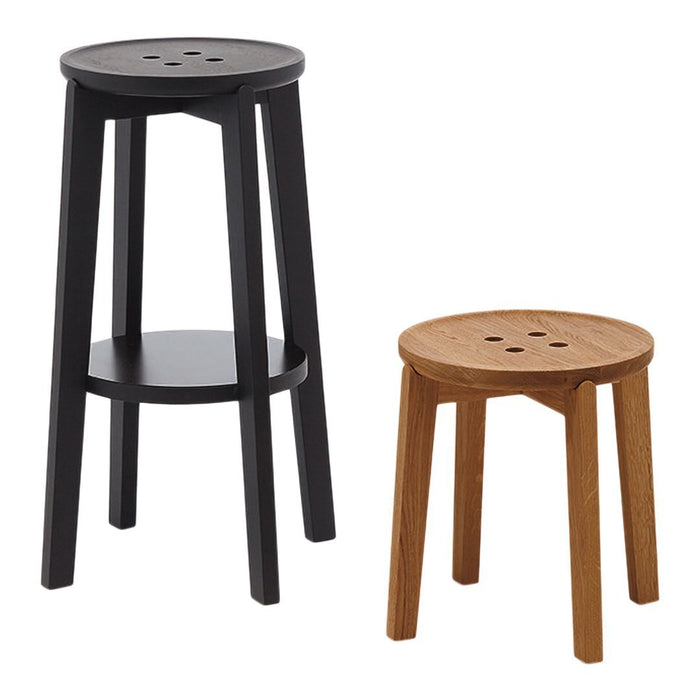 Black and natural wood bar stools with round tops, featuring sleek designs and minimal patterns.