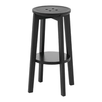 Black wooden stool with a round seat and simple design, featuring a lower shelf and three round holes on top.
