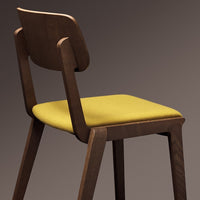 Brown wooden chair with a vibrant yellow upholstered seat. Simple, modern design with clean lines.