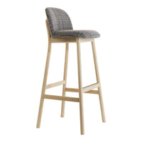 Gray checkered pattern upholstery on a modern bar stool with light wood legs. Elegant and stylish for any space.
