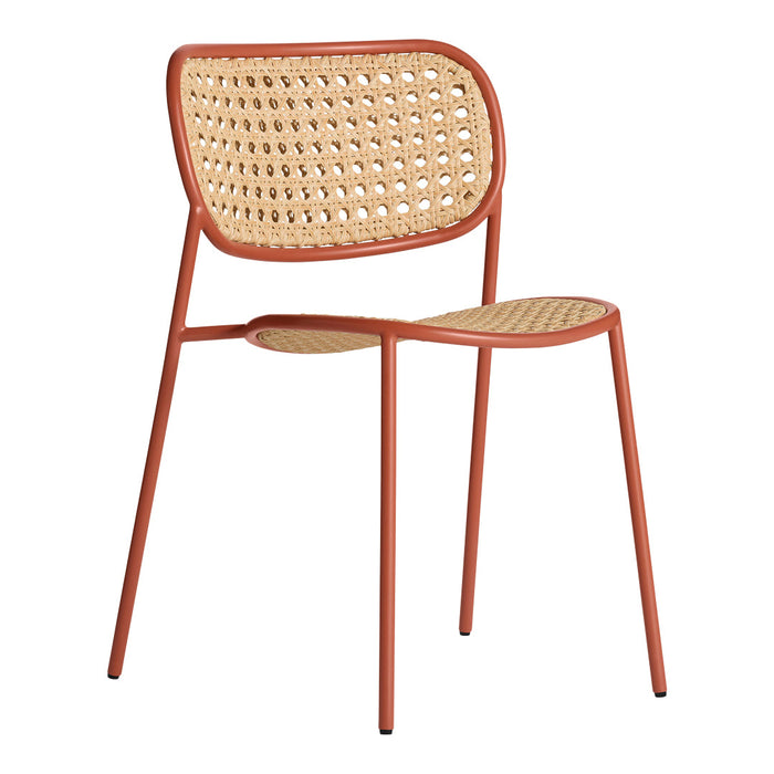 Modern chair in terracotta with natural cane weaving, featuring minimalist design and airy pattern. Perfect for decor.