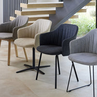 Set of four upholstered chairs in light beige, dark gray, and textured patterns, featuring sleek legs and modern design.
