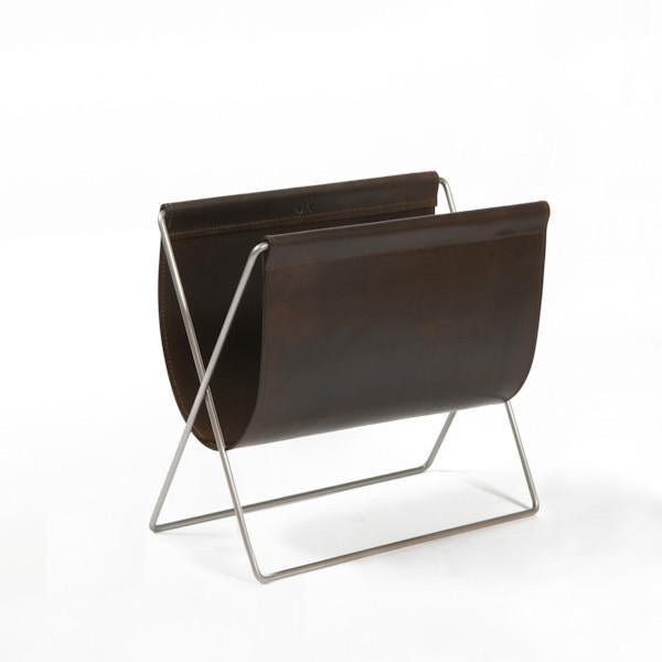 Dark brown metal magazine holder with sleek white metal frame in modern design. Perfect for contemporary decor.