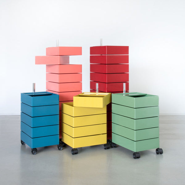 Colorful stackable storage boxes in blue, green, yellow, coral, and red with sleek modern design.