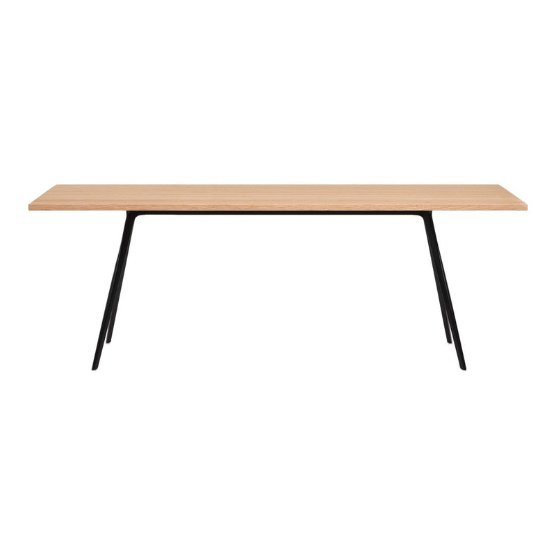 Light oak table top with a smooth finish, accented by sleek black metal legs. Modern and minimalist design.