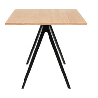 Light oak tabletop with a natural wood grain pattern, paired with sleek black metal legs. Modern, minimalist design.