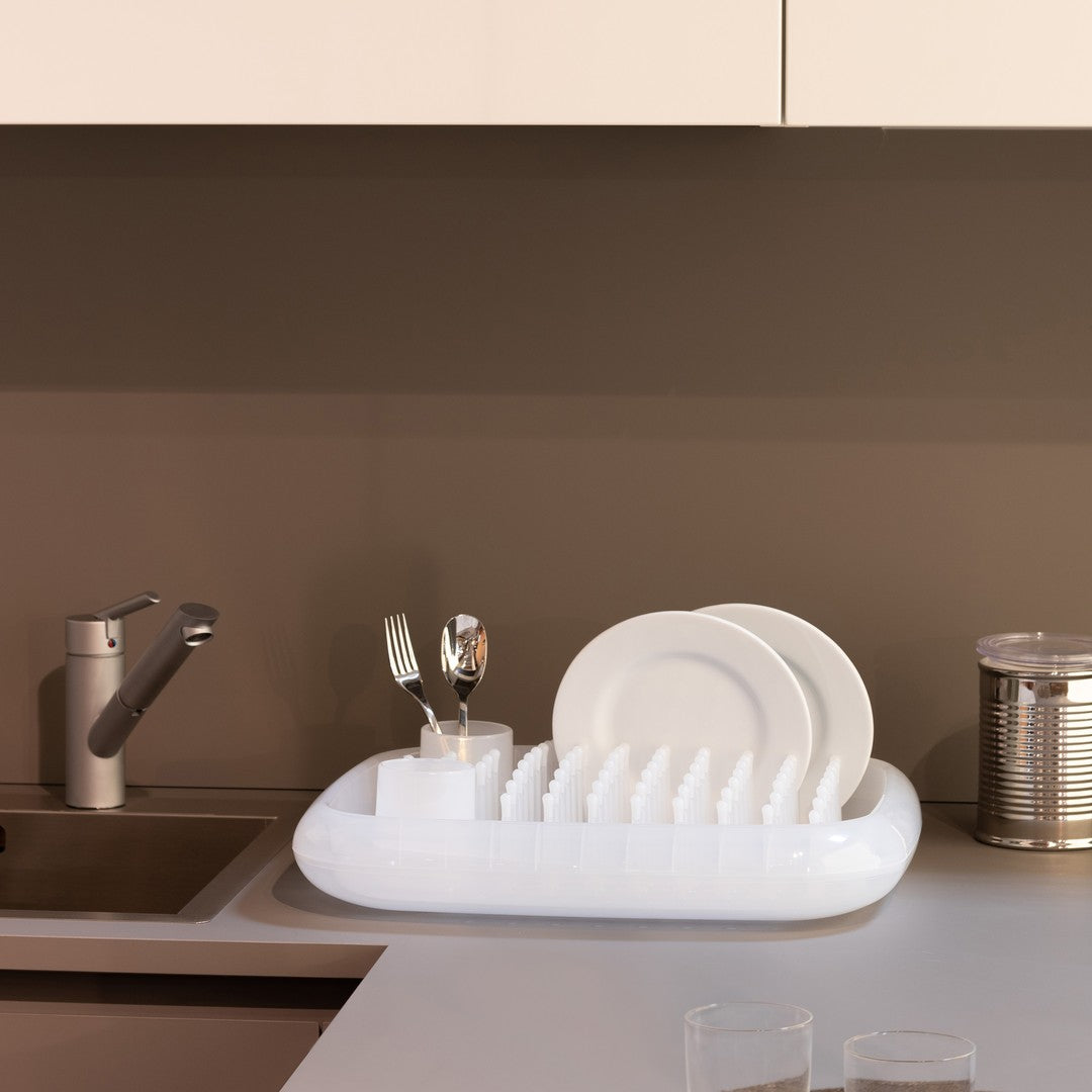 White dish rack with glossy finish, featuring sleek, modern lines against a neutral background. Minimalist kitchen aesthetic.