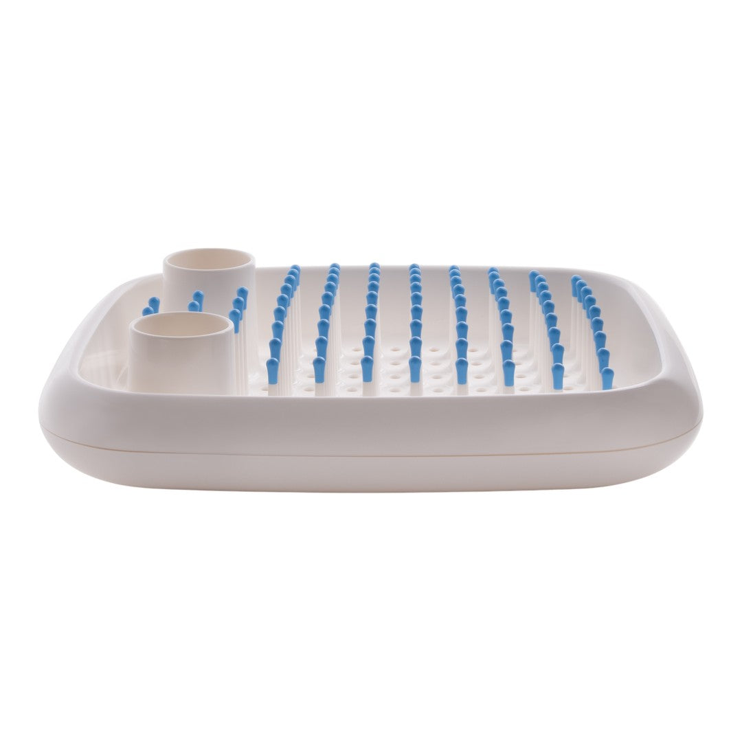 White tray with blue spikes and cups, featuring a minimalist and modern design. Perfect for organization.