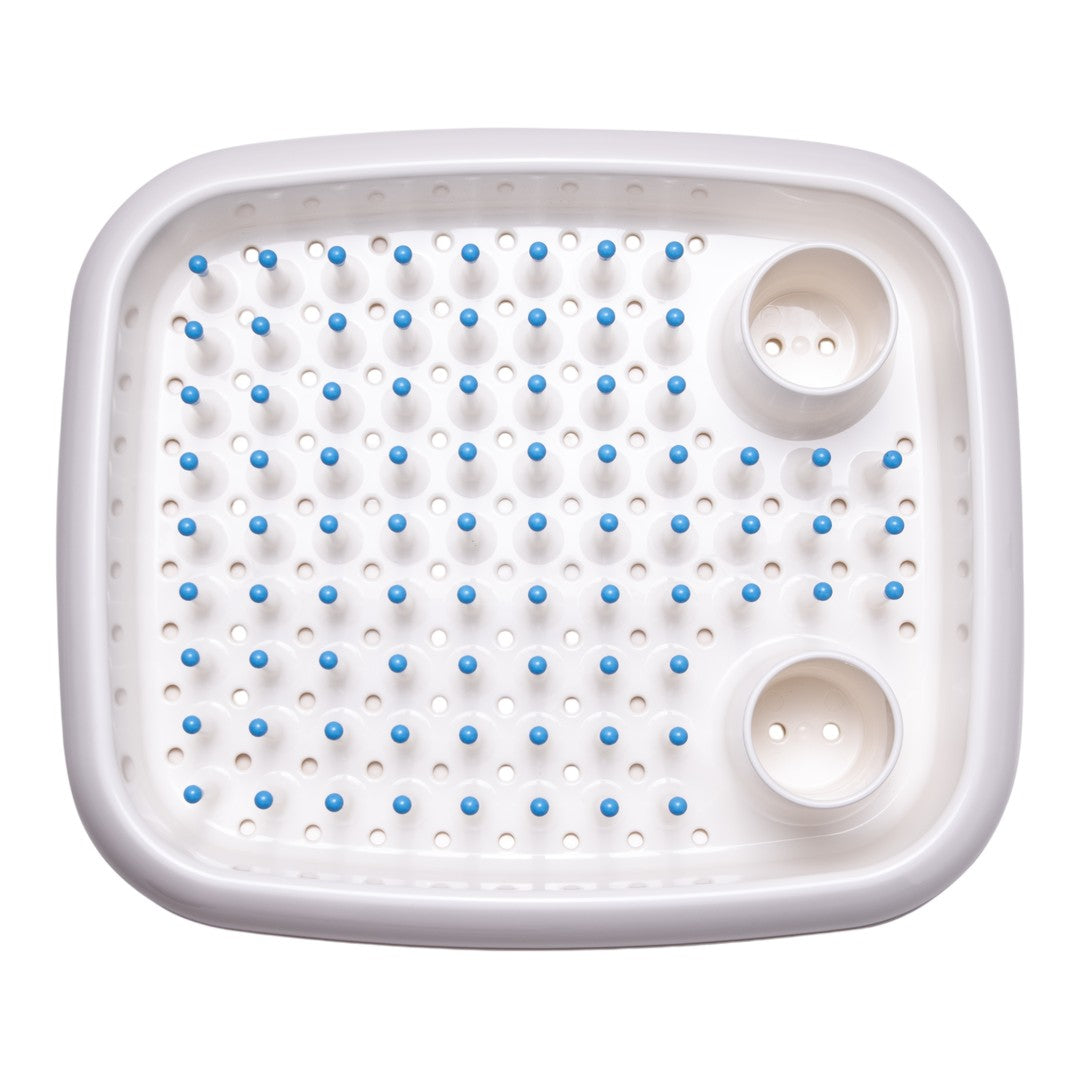 White rectangular tray with blue dots and raised spikes for added texture and grip. Perfect for functional use.