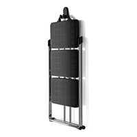 Black folding chair with patterned seats and shiny chrome frame, perfect for modern decor. Ideal for space-saving needs.