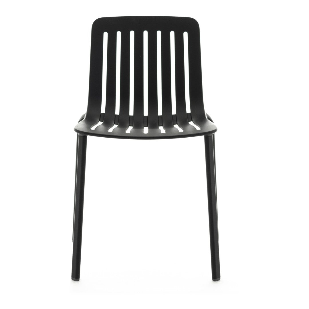 Black minimalist chair with vertical slat pattern and smooth finish, perfect for modern decor.