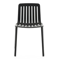 Black minimalist chair with vertical slat pattern and smooth finish, perfect for modern decor.