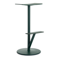Green metal standing table with minimalist design and smooth surfaces, featuring geometric shapes and elegant lines.