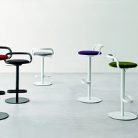 Colorful modern bar stools in black, white, red, purple, and green with sleek, minimalistic designs.