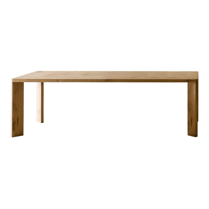 Light brown, minimalist wooden dining table with a smooth, solid surface and clean, angular lines.