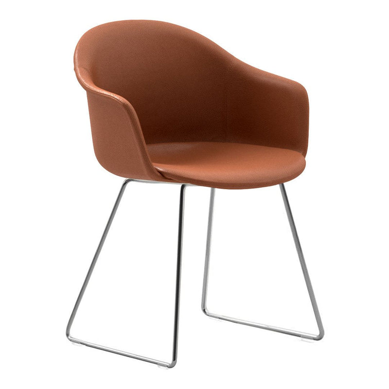 Rust-colored modern chair with smooth upholstery and sleek silver legs, perfect for contemporary decor.
