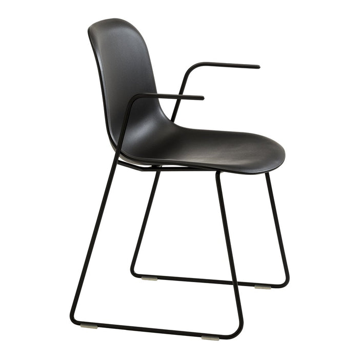 Black modern chair with smooth curves and a minimalist design, featuring a sleek metal frame.