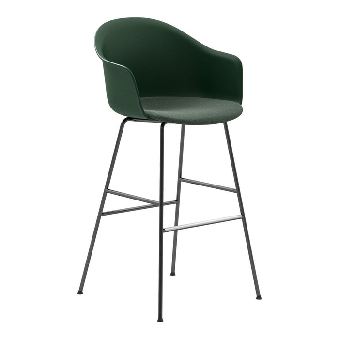 Green molded chair with a curved backrest and black metal legs, perfect for modern interiors.
